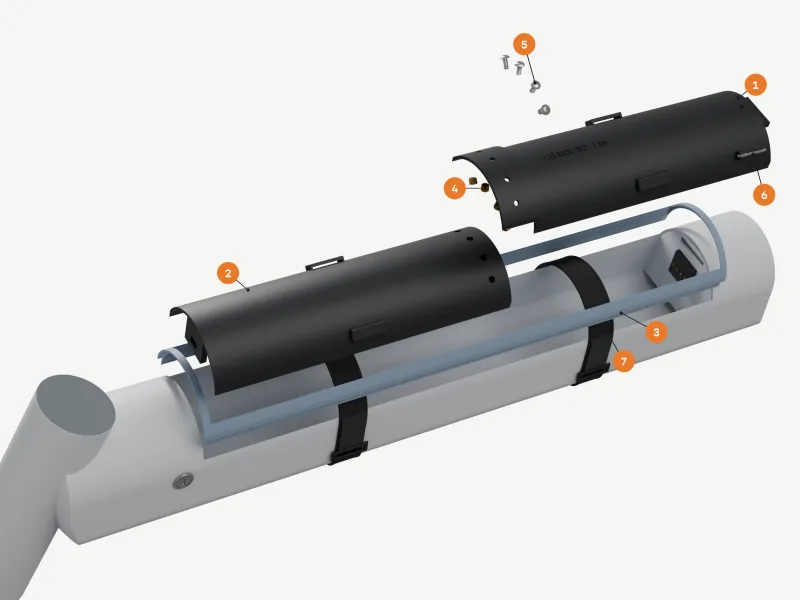 Exploded straight out of the bay: the two black segments lifted above it with the TPU lip frames between them and the tube, four brass inserts and four button-head bolts above the lap, the tether on the lower segment's ear and the two straps left round the tube, numbered as in the parts list.