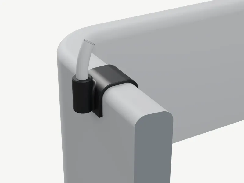 Render of a black clip hooked over a clay-grey section of the Urban Arrow box rim, a Ø10 rain-cover pole rising from its round socket and bending a little inwards.